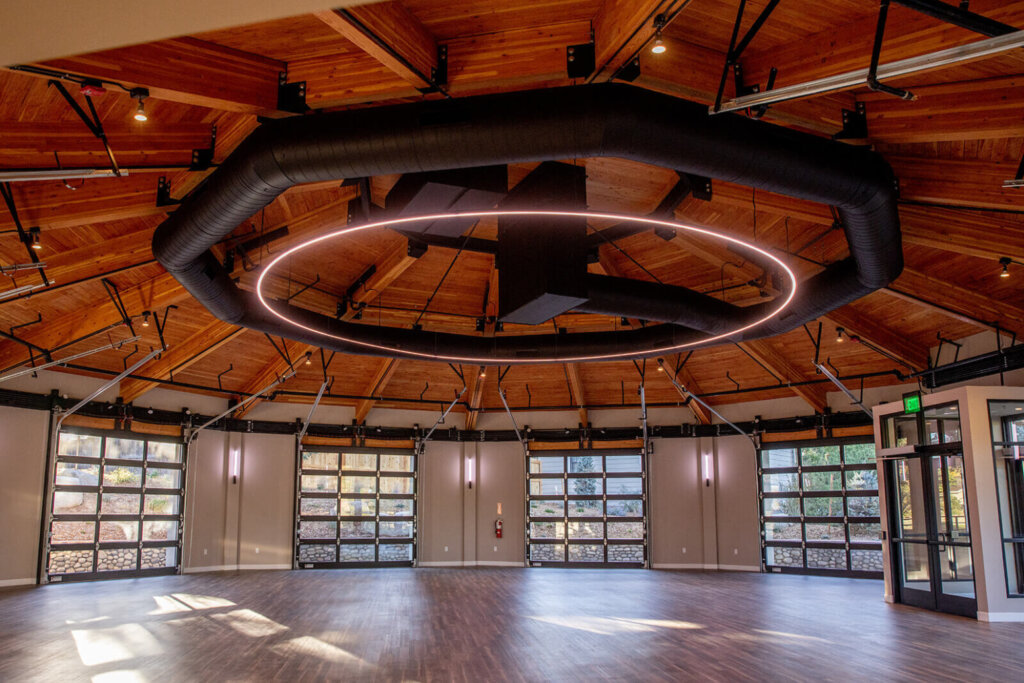 Interior of bloom room showing main lighting fixture and garage doors