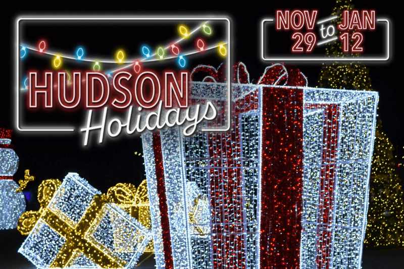 Image of large, light-up present with a neon Hudson Holidays logo and Nov. 29-Jan 12 text.