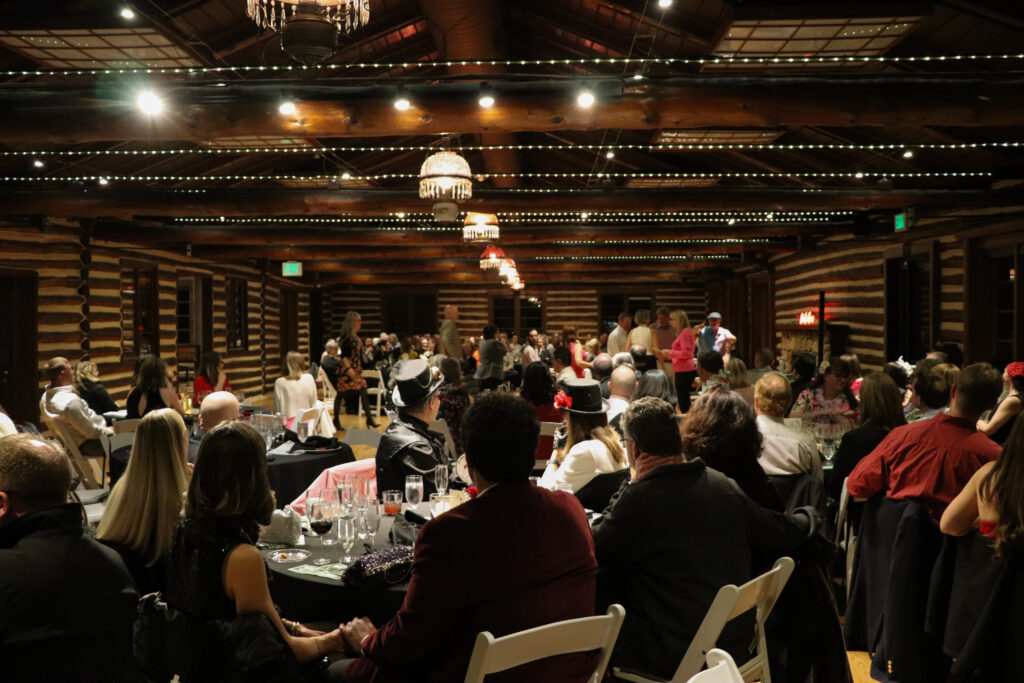 People seated at dining tables at the Inn at Hudson Gardens