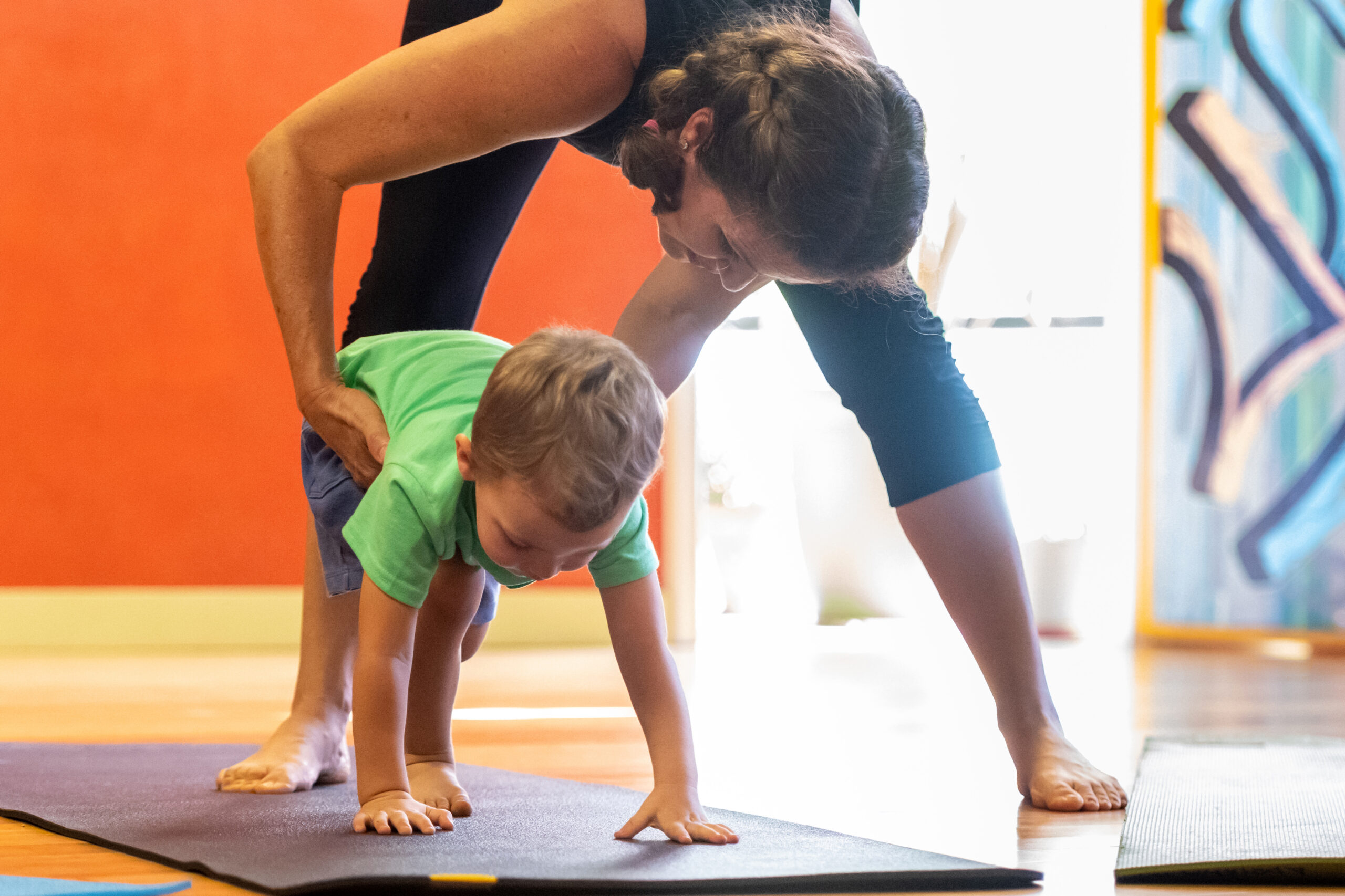 Caucasian male Toddler with his mom at children yoga class