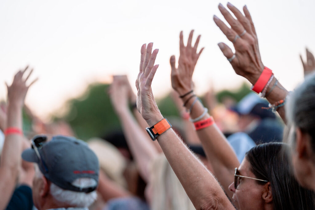 Hands raised at Hudson Gardens concert