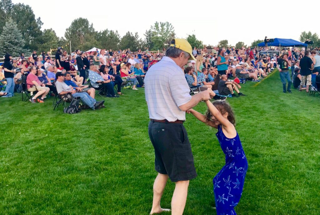 Father and Daughter dancing at Hudson Gardens Concert
