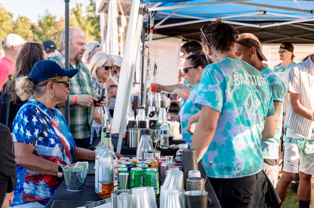 People at a bar tent