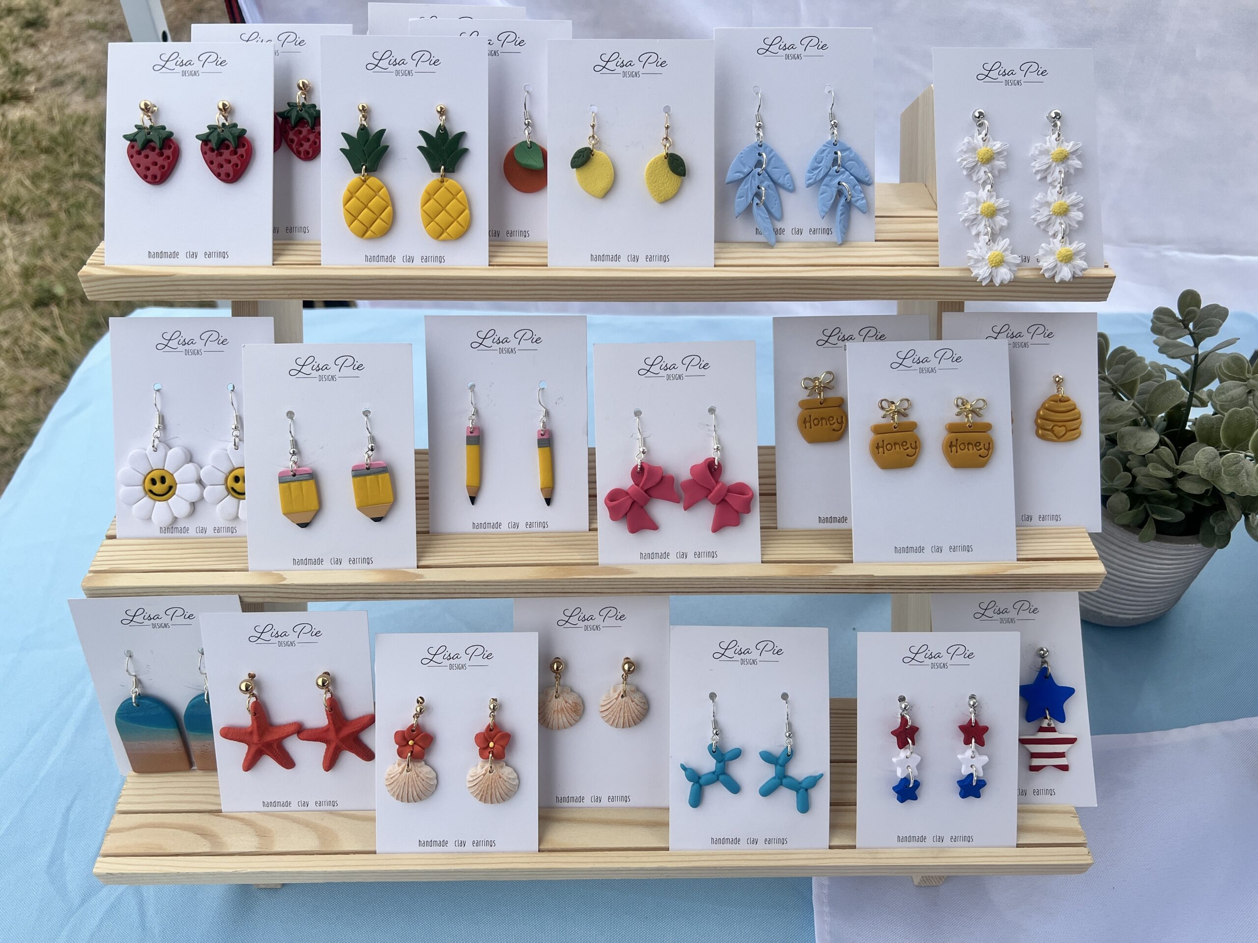 Display of colorful handmade polymer earrings