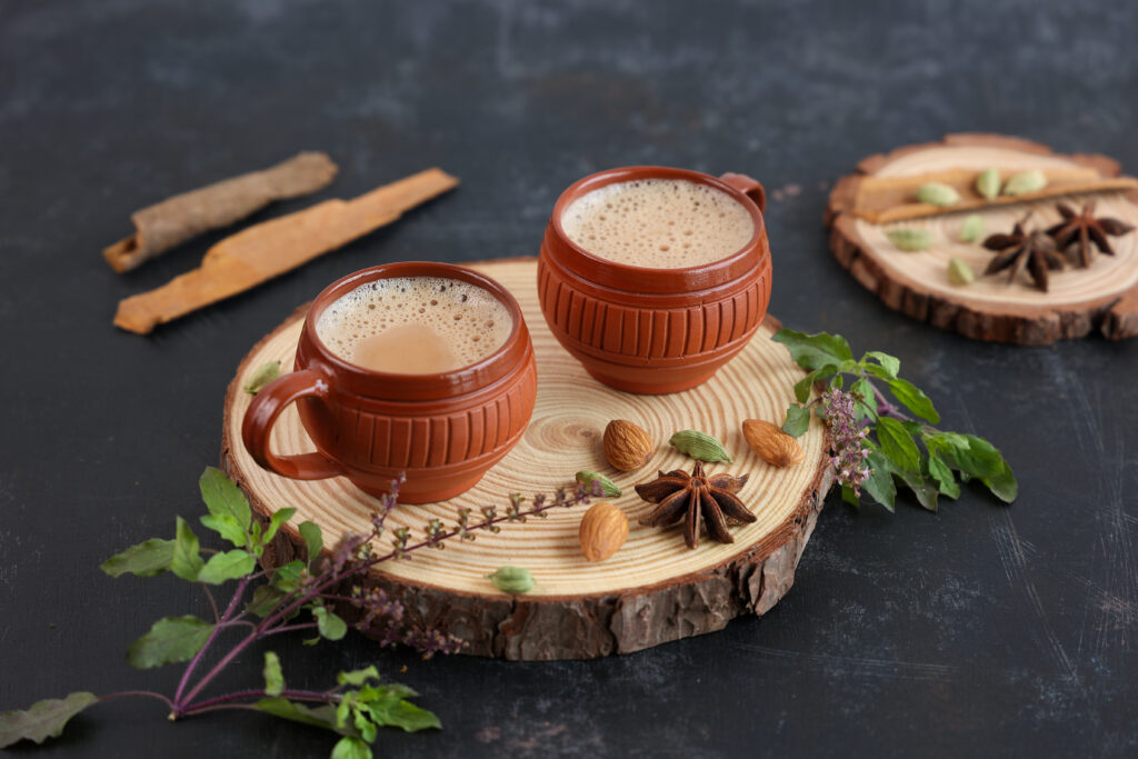 Top view of Indian herbal Masala Chai or traditional beverage tea with milk and spices Kerala India.