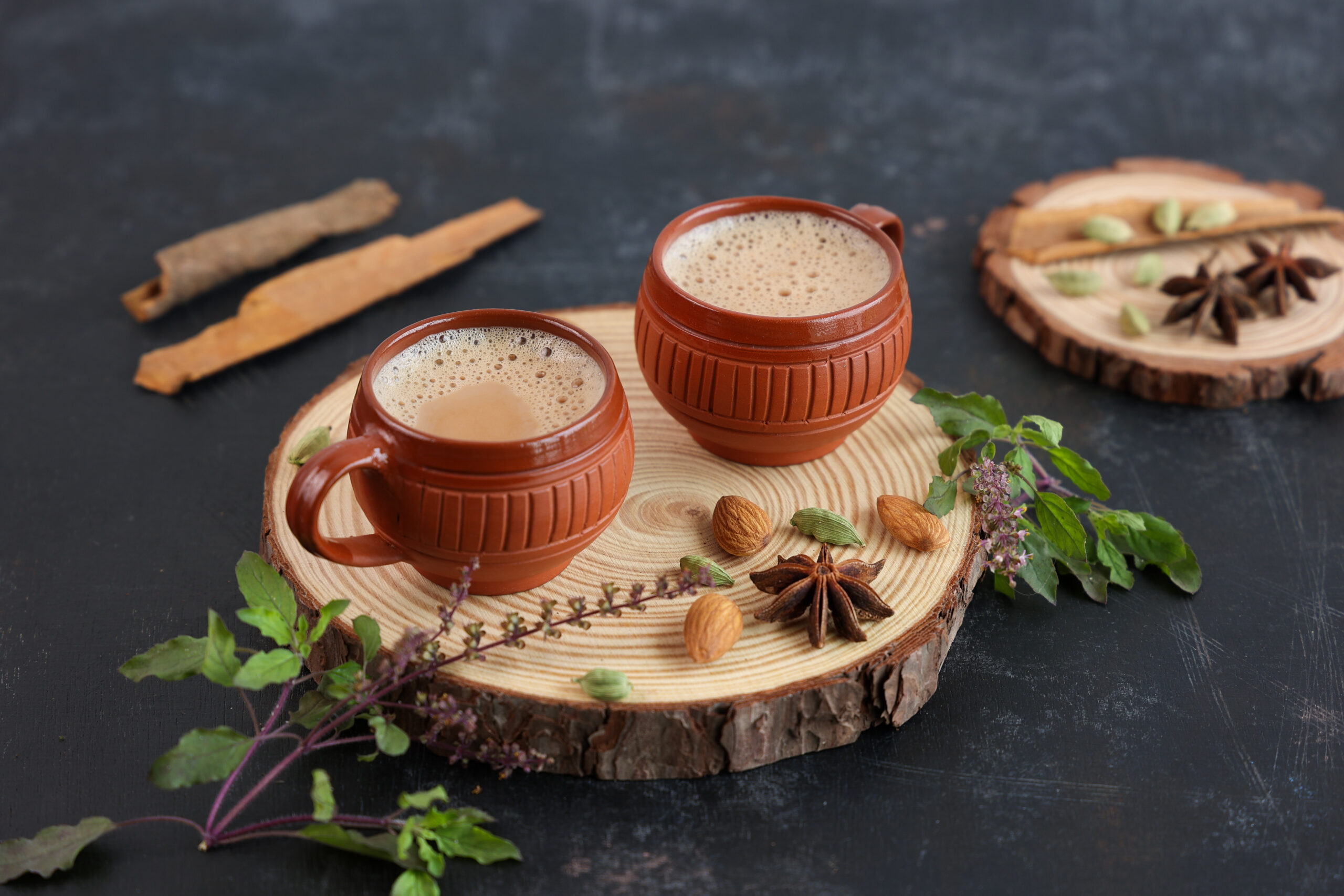 Top view of Indian herbal Masala Chai or traditional beverage tea with milk and spices Kerala India.
