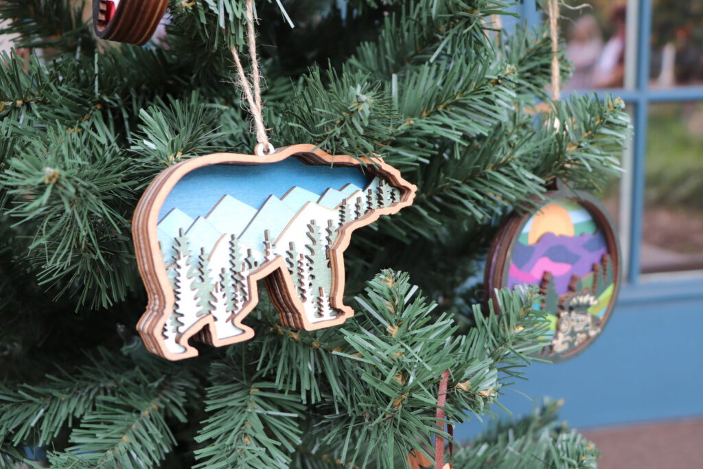 Bear-shaped ornament with mountains in the center