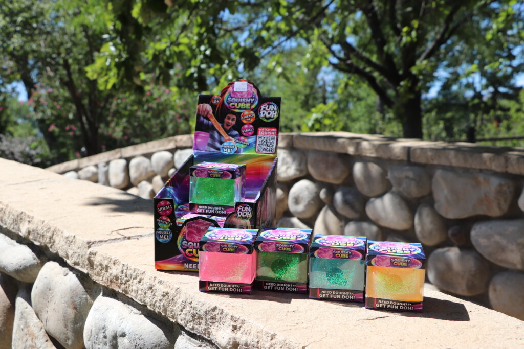 Squishy cubes display outside on a stone wall