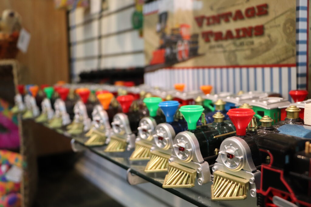 Toy trains lined up on a shelf