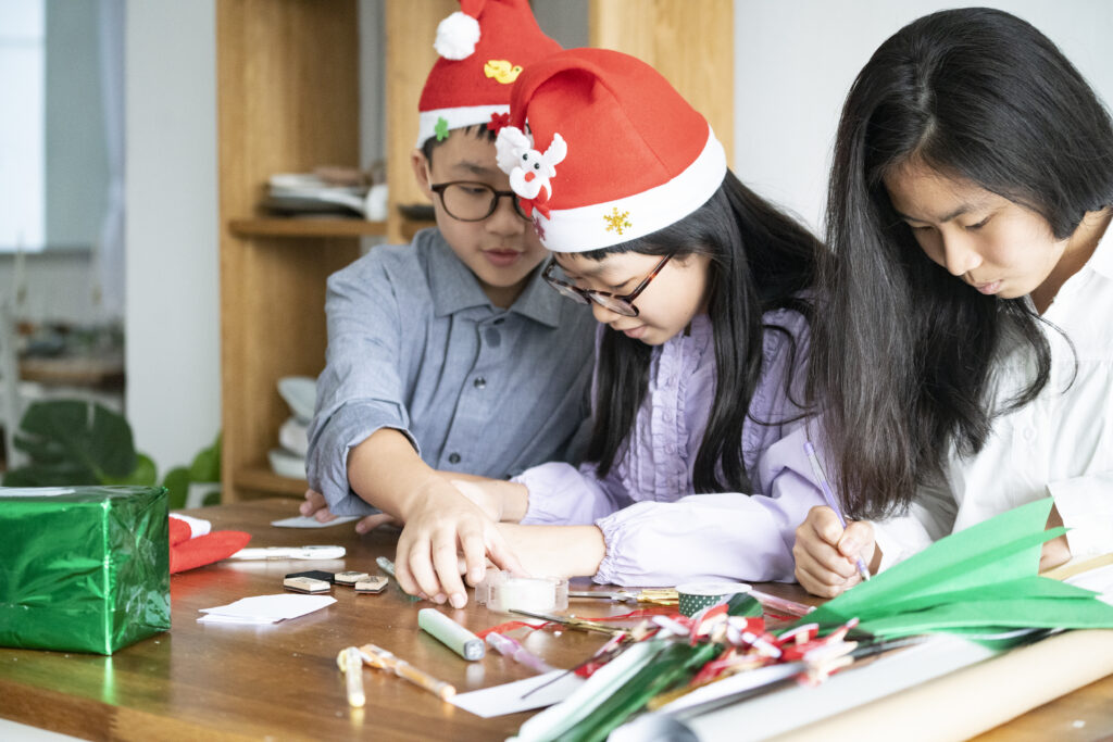 Family working on holiday crafts